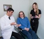 The Dr. and assistant talking with a patient