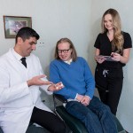 The Dr. and assistant talking with a patient