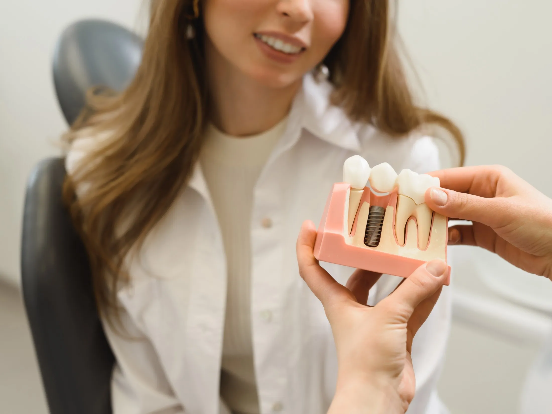 person showing woman model of implant
